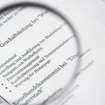 magnifying glass over printed text