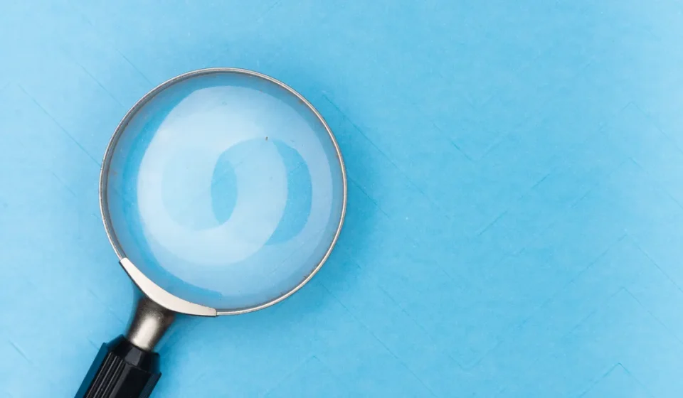 magnifying glass on blue background