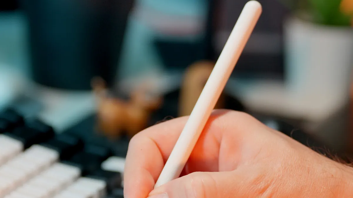 Ai Writing Business Ai Writing Business — Person Writing on Digital Tablet in Office Setting