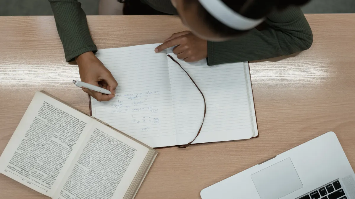Ai Writing Tools: Reviews & Comparisons — A Girl Writing on a Notebook
