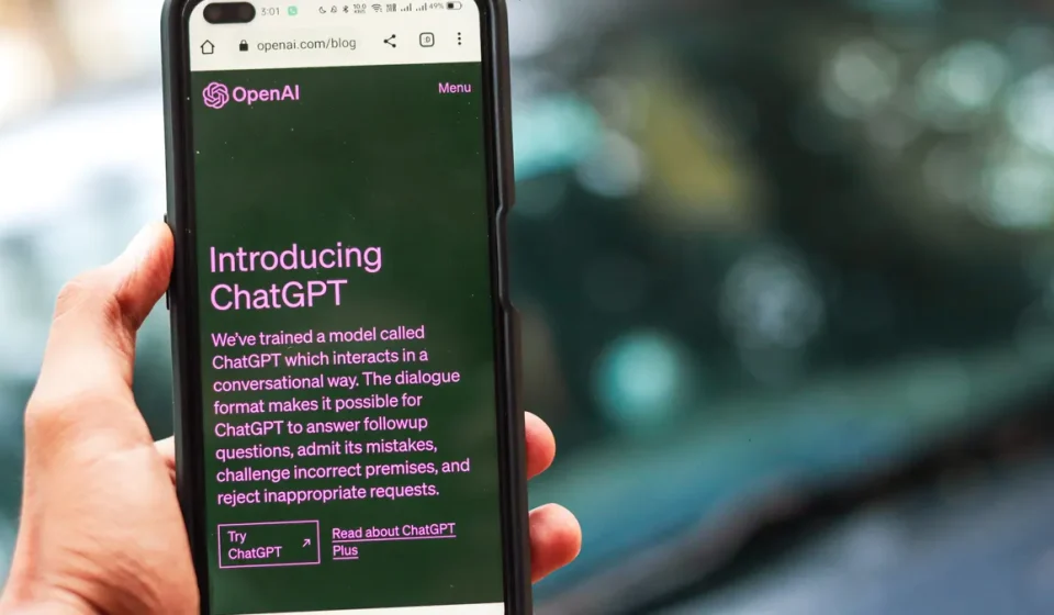 Hand holding a phone with ChatGPT open