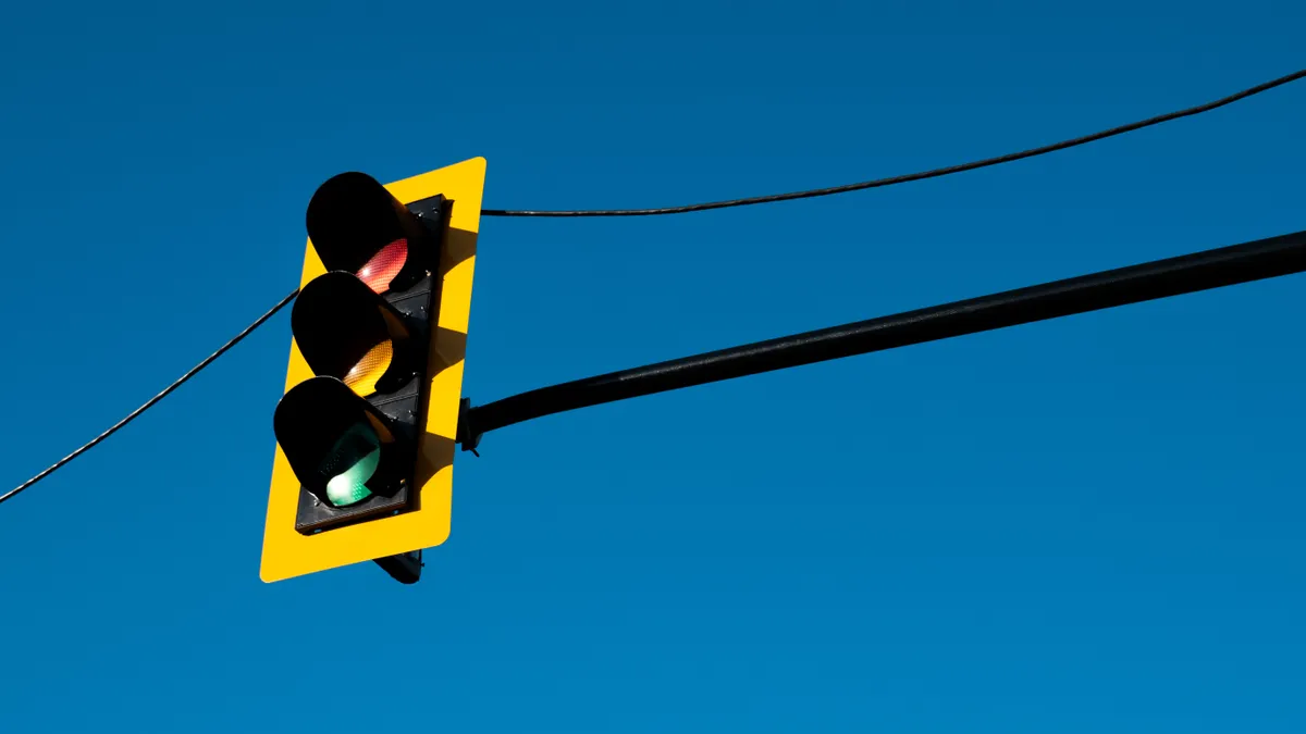How to build an approval process for AI-assisted SEO content Traffic light against a clear blue sky