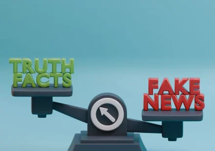 Balance scale labeled truth and fake news