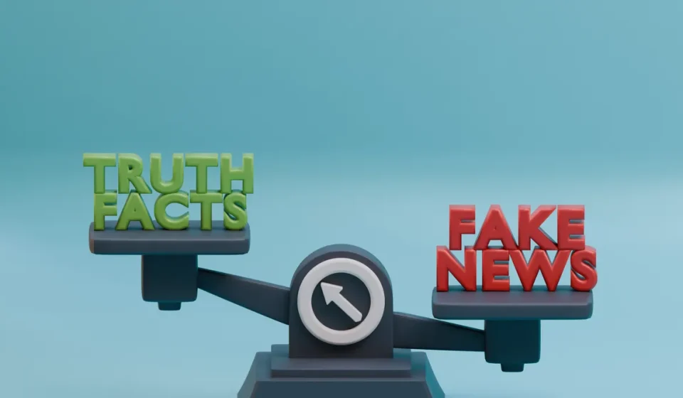 Balance scale labeled truth and fake news