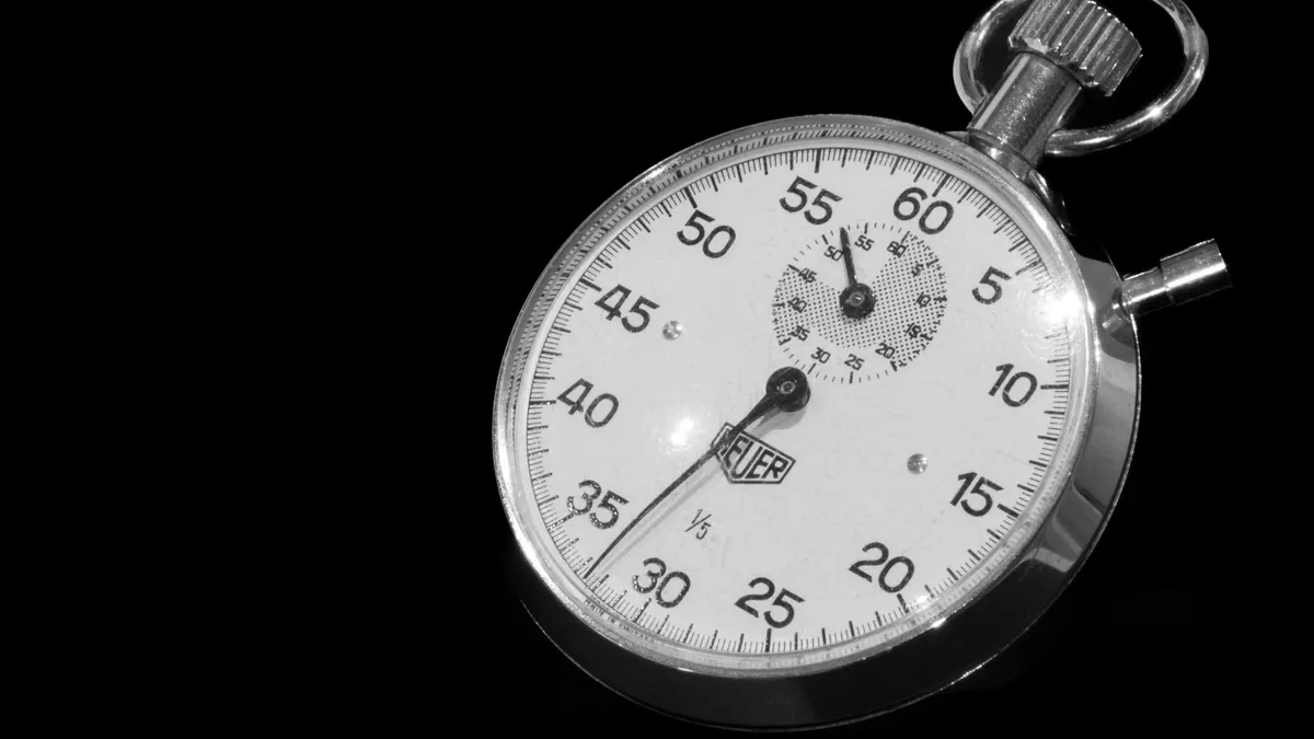 How to measure whether your AI SEO workflow is saving time Silver stopwatch on black background